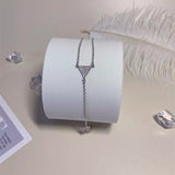 bracelet bague strass triangle argente